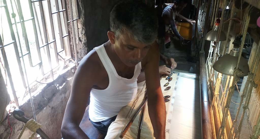 Weavers like Amitava Pal are busy weaving the Baluchari handcrafted saree, as demand peaks during the festive Durga Puja season (Photo by Gurvinder Singh)